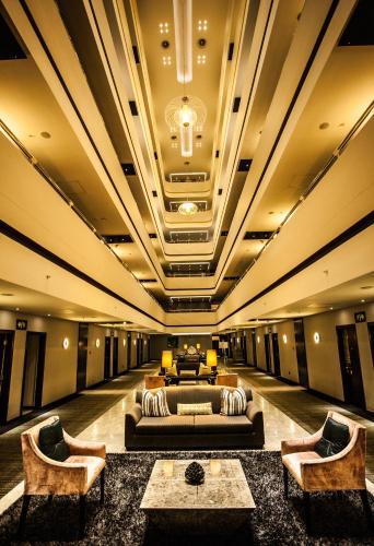 a large living room with a couch and chairs at Coastlands Umhlanga Hotel and Convention Centre in Durban