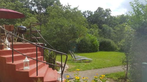 a view of a garden from a house at Business Apartments Netzeband in Netzeband