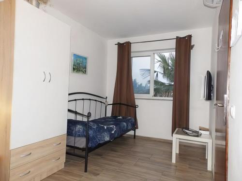 Postel nebo postele na pokoji v ubytování Apartmani Maria - Studio 3