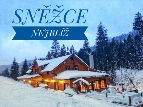 a book cover of a house in the snow at bouda Pod Sněžkou in Pec pod Sněžkou
