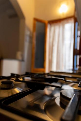 a close up of a stove top in a kitchen at Nice to stay in Fontane Bianche