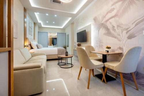a living room with a couch and a bed at Apartmani Laguna in Neum