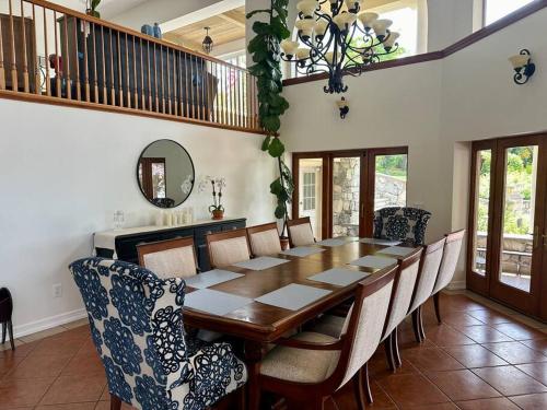 a dining room with a wooden table and chairs at Hudson River Valley Estate New Listing in Verplanck