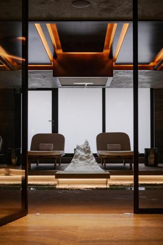 a view of a room with two chairs and a sculpture at No 14 Verbier in Verbier