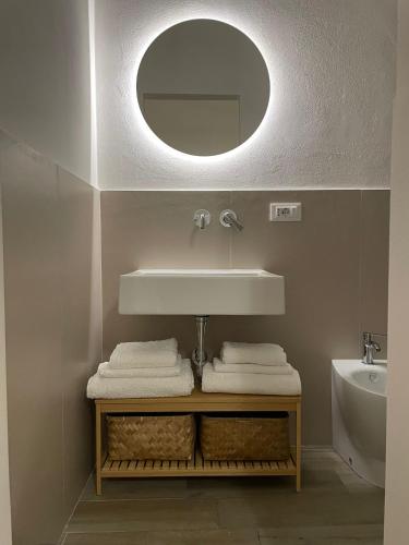 a bathroom with a sink and a mirror at Casa Vacanza Pitagora in Montalbano Ionico