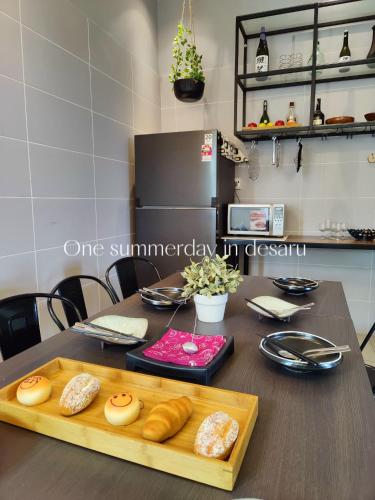a table with a cutting board with some food on it at One Summerday in Desaru in Kangkar Chemaran