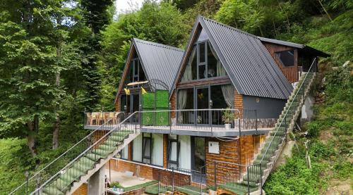 a house with stairs leading up to it at ZeRa Suit Bungalov Rize in Ardeşen