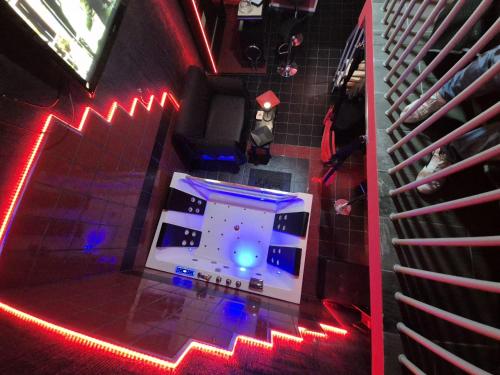 an overhead view of a room with red and blue lights at Nouvelle Maison Relax in Leonforte