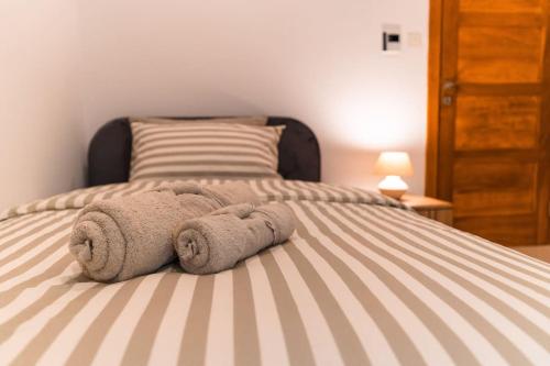 a bedroom with a bed with towels on it at Sea Front - Spacious - Beautiful in Sliema