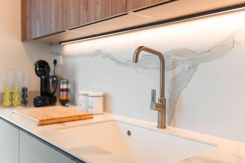 a kitchen counter top with a sink and a sink at Sea Front - Spacious - Beautiful in Sliema