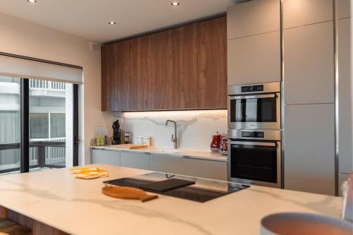 a kitchen with a counter and a stove top oven at Sea Front - Spacious - Beautiful in Sliema
