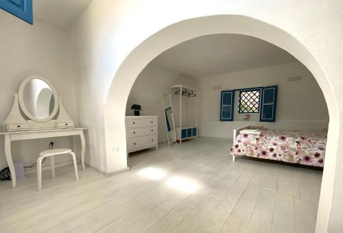 Кровать или кровати в номере La Mia Valigia a Stromboli