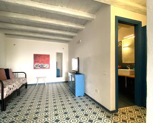 Кровать или кровати в номере La Mia Valigia a Stromboli