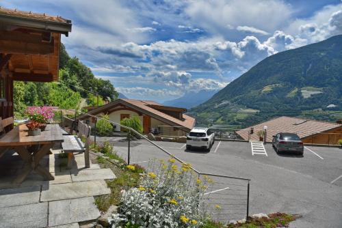 a parking lot with a view of a mountain at Residence Blumenthalerhof in Lagundo