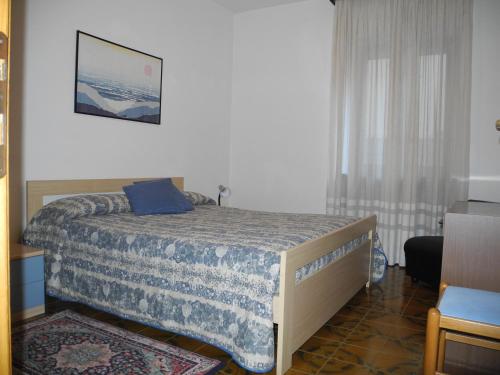 מיטה או מיטות בחדר ב-Casa Cressotti appartamenti