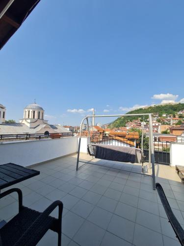 a balcony with a view of a city at Guesthouse Hotel My Home in Prizren