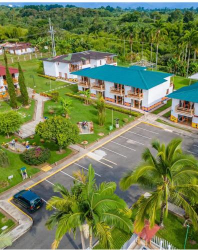 an aerial view of a resort with a parking lot at Hotel Campestre La Aldea Cabaña Pijao in Montenegro