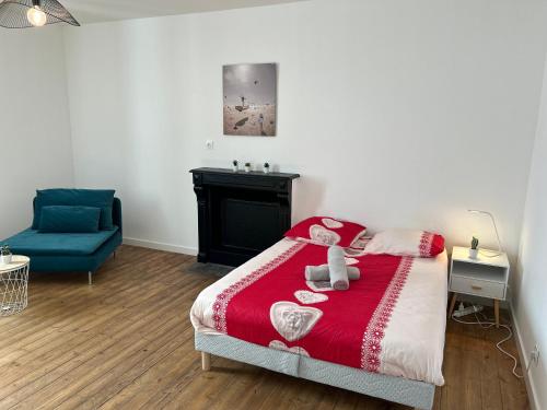 En eller flere senge i et værelse på Kery House Calme et proche du Centre