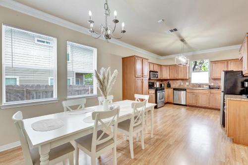 a kitchen with a white dining room table and chairs at Spacious Home-Queen Suite-Game room-Movie room in Austin