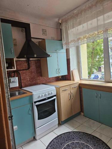 Kuchyň nebo kuchyňský kout v ubytování Suncity 2 apartamentai