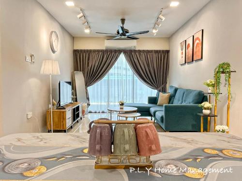 a living room with a bed and a couch at Manhattan Condo Ipoh Waterpark PoolView FREE Carpark & Netflix by PLY Home in Ipoh