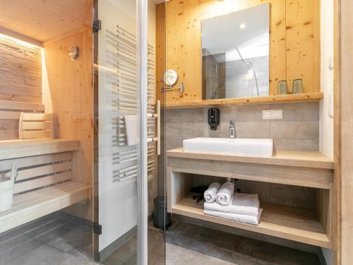 a bathroom with a sink and a mirror at Apart33 Top 1-28 in Haus im Ennstal