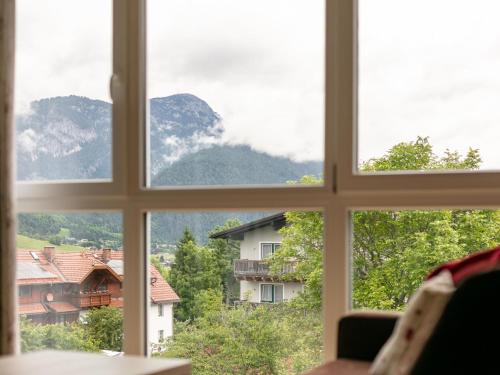 a window with a view of a mountain view at Apart33 Top 1-27 in Haus im Ennstal