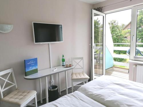 Hotel Möven-Kiekerにあるテレビまたはエンターテインメントセンター