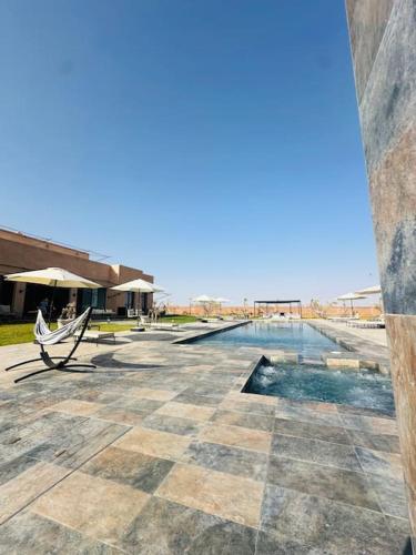 Πισίνα στο ή κοντά στο Somptueuse Villa avec Paddle, Hammam et Wi-Fi