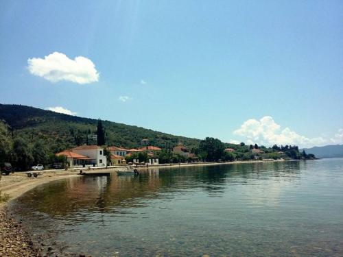 a view of a river with a beach and houses at Margianou Seaview Apartments 3 & 4 in Kálamos