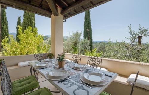 a table and chairs on a porch with a view at Nice Home In Torri In Sabina With Wifi in Torri in Sabina