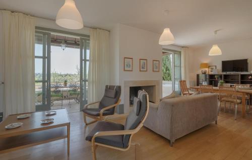 a living room with a couch and a fireplace at Nice Home In Torri In Sabina With Wifi in Torri in Sabina