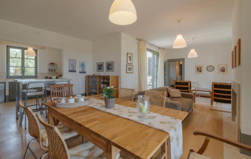 a dining room and living room with a table and chairs at Nice Home In Torri In Sabina With Wifi in Torri in Sabina