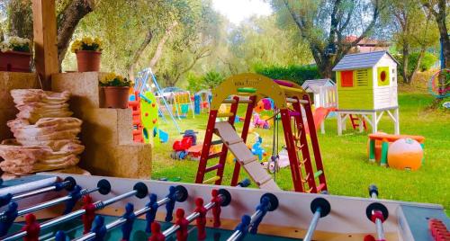 a playground with a bunch of different types of play equipment at Green Park Hotel & Residence in Bagnara Calabra