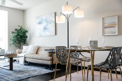 a living room with a table and a couch at Lovely 1 BD in West Hollywood in Los Angeles