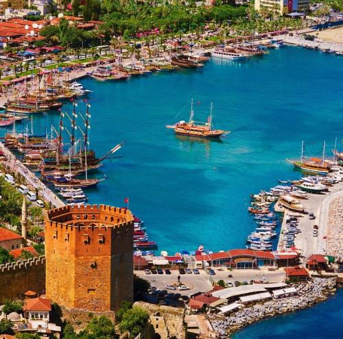 an aerial view of a harbor with boats in the water at ÖZ BEYDAĞLI TURiZM in Alanya