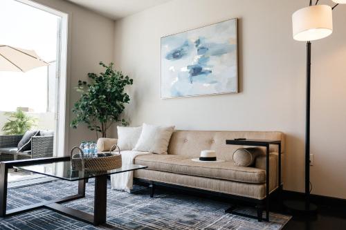 a living room with a couch and a table at Lovely 1 BD in West Hollywood in Los Angeles