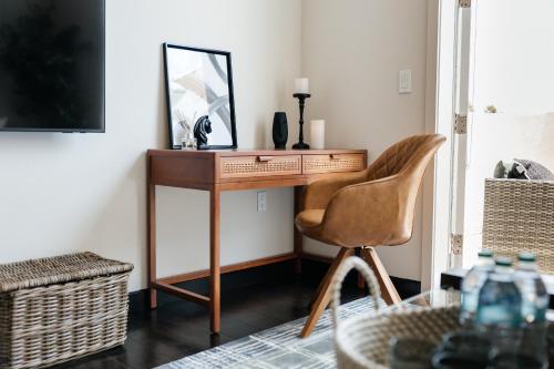 a desk in a room with a chair and a mirror at Lovely 1 BD in West Hollywood in Los Angeles