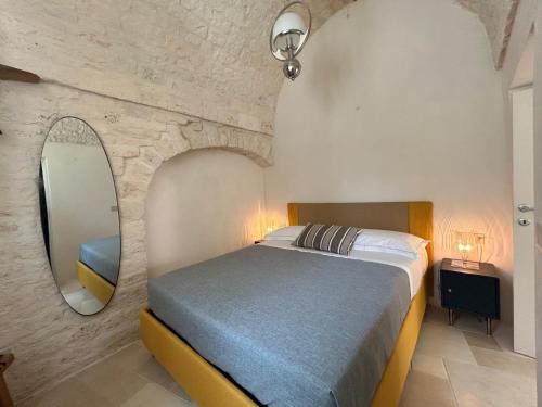 Ένα ή περισσότερα κρεβάτια σε δωμάτιο στο Montesanto 60 Suite & Relax Alberobello
