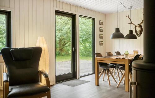 a dining room with a table and chairs at Beautiful Home In Give With Kitchen in Give