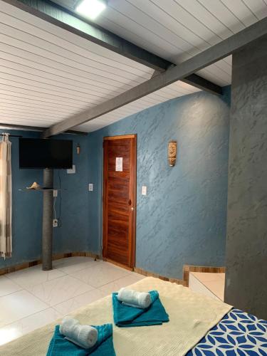 Ένα ή περισσότερα κρεβάτια σε δωμάτιο στο Pousada Villa Flamboyant