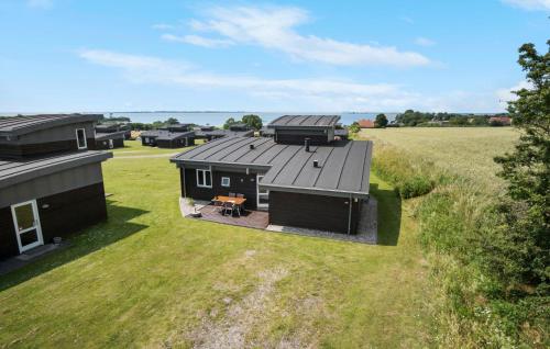 an overhead view of a tiny house in a field at Holiday Home Mosegården Faaborg I in Fåborg