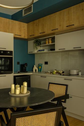 a kitchen with a table with candles on it at The Offset in Ioannina
