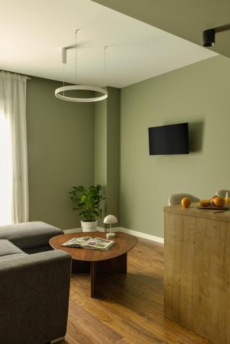 a living room with a couch and a table at The Offset in Ioannina