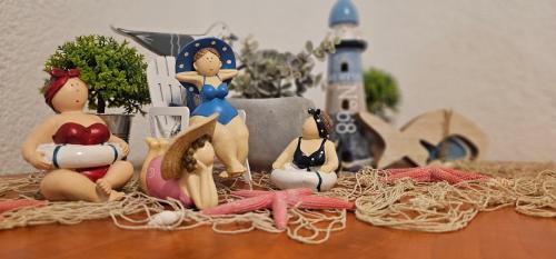 a group of figurines sitting on top of a table at SOBE/ROOMS RIVA in Zadar
