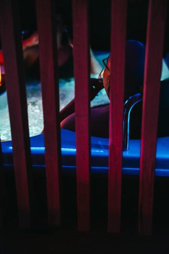 a child sitting in a seat on a carnival ride at La maison d Aurore loft et spa privatif in Couvin