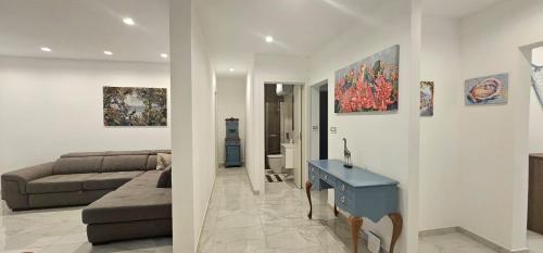 a living room with a couch and a table at Modern Elegance Valletta Apartment V1 in Valletta