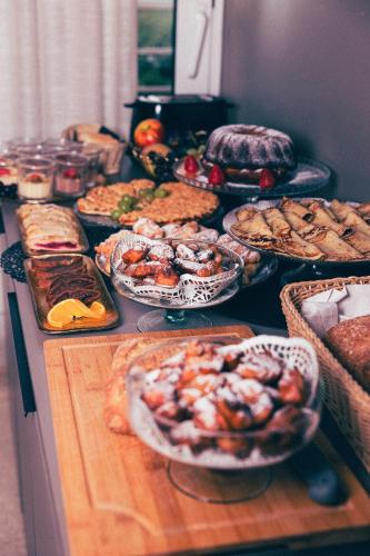 a table topped with lots of different types of food at Hotel Fanat in Split