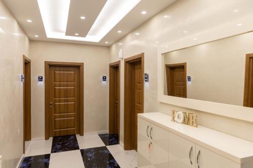 a bathroom with a sink and a mirror at Apartments DoriDitaRejjan in Ulcinj