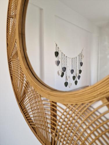 a mirror with a reflection of a group of musical instruments at Cerry's Apartments Fronte Mare - Seaside & Sealight in Fossacesia